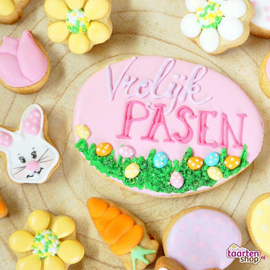 Vrolijk pasen koekje met gras en eitjes